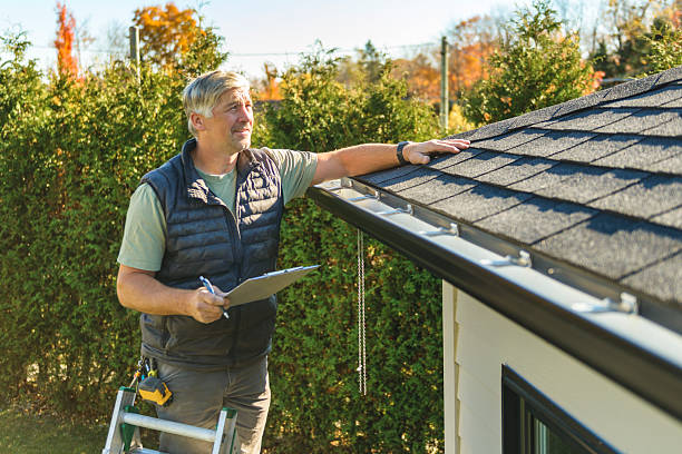Professional Storm Damage Roof Repair technician working in Brush, CO